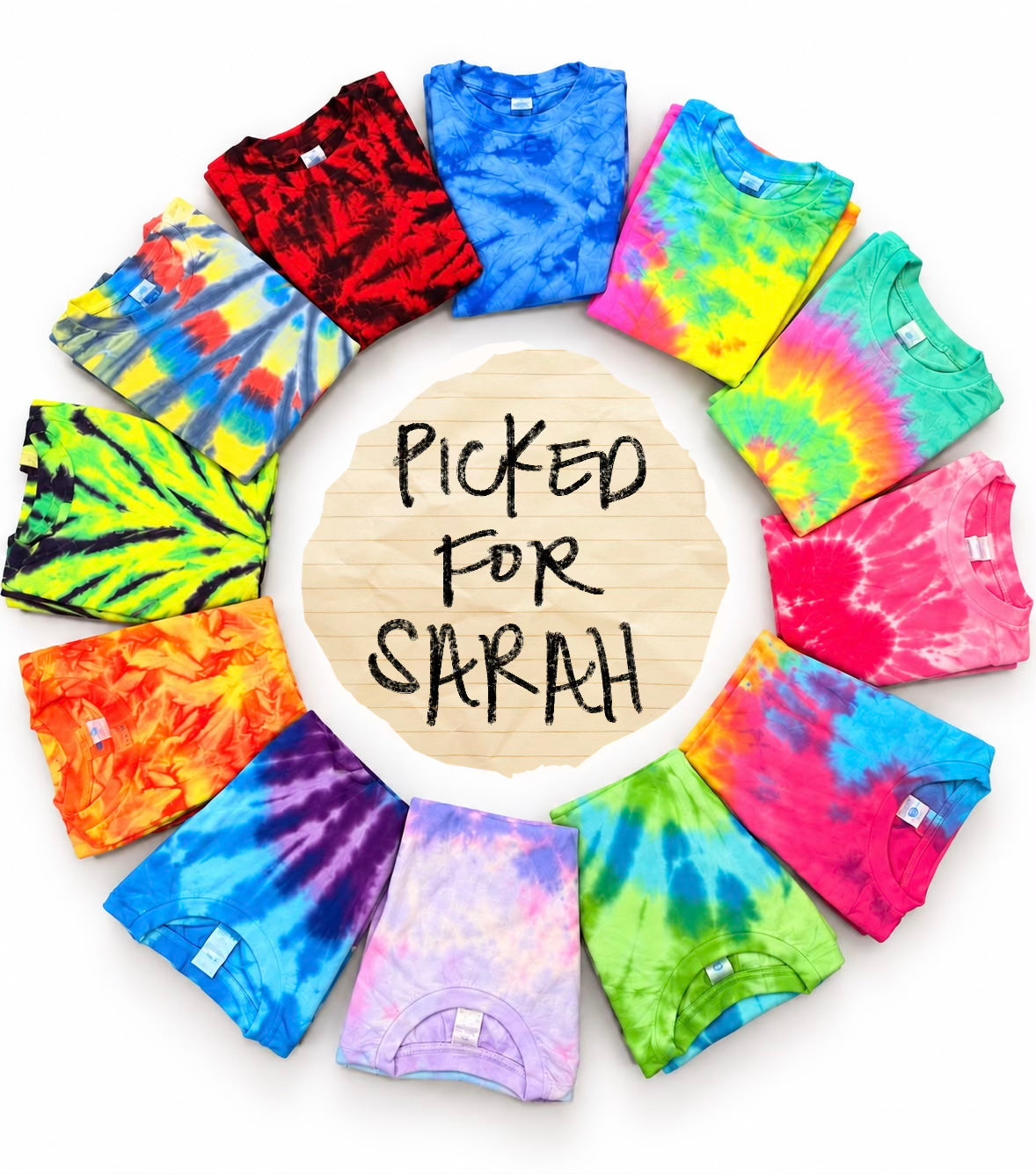 Twelve folded hand-dyed tie-dye tees in a circle around a handwritten note that says Picked for Sarah