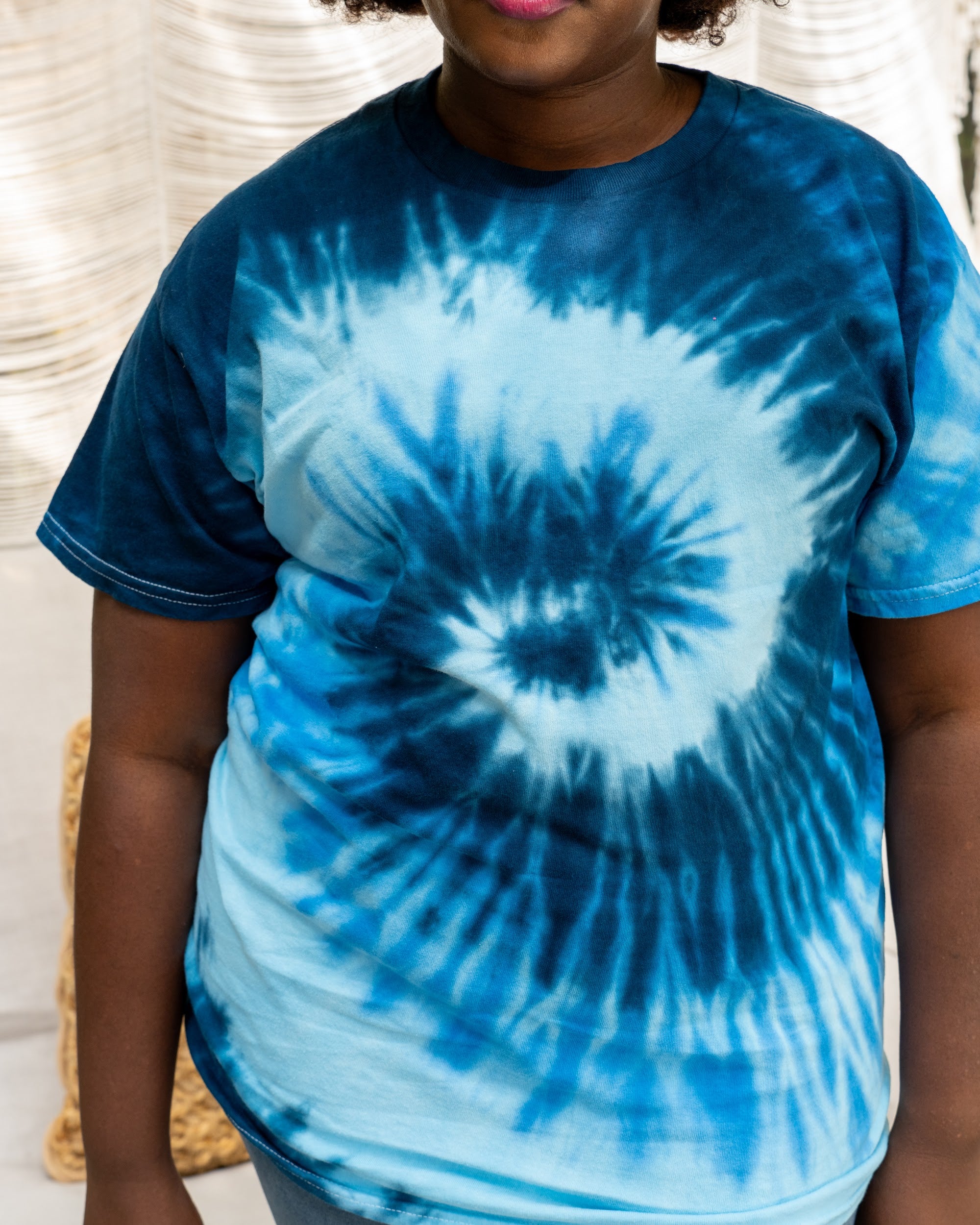 Blue Ocean tee on a plus-size model, close-up of the hand-dyed pattern